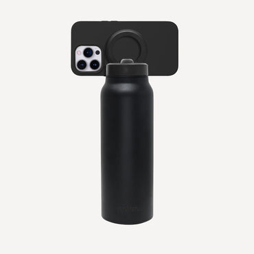Carbon magnetic water bottle with phone mount used as a tripod for filming and hands-free content viewing
