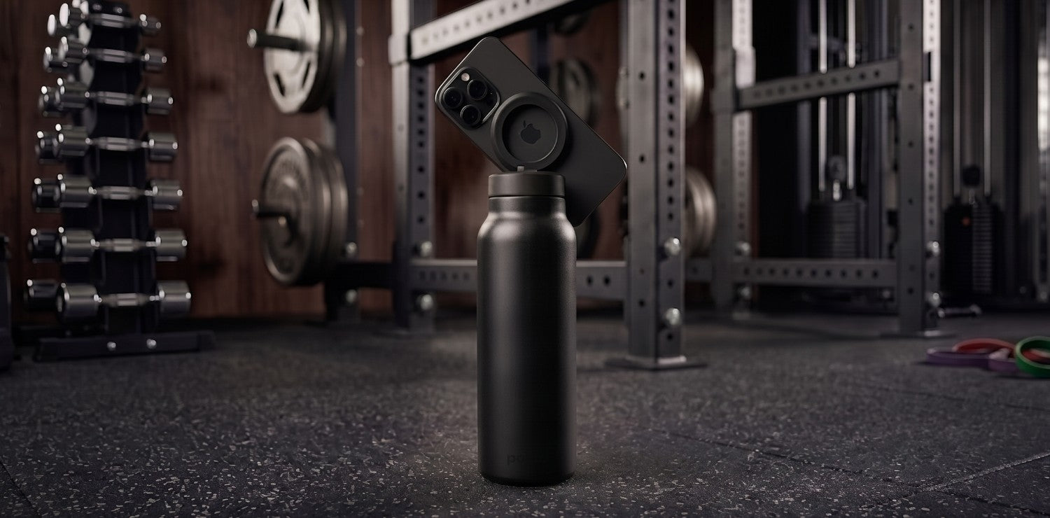 Carbon magnetic water bottle phone holder used as a workout tripod for filming in the gym