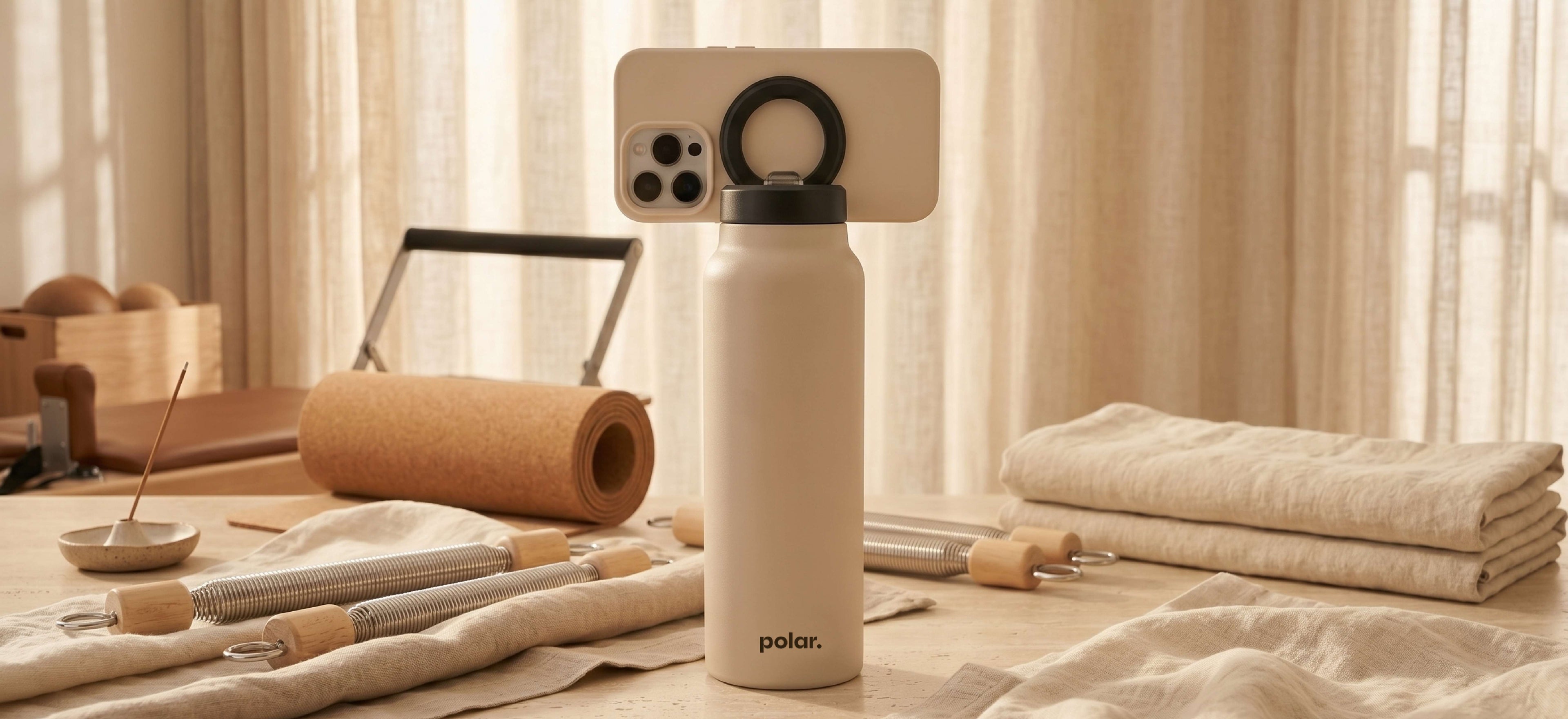Sand magnetic water bottle phone stand used for hands-free viewing and everyday routines at home