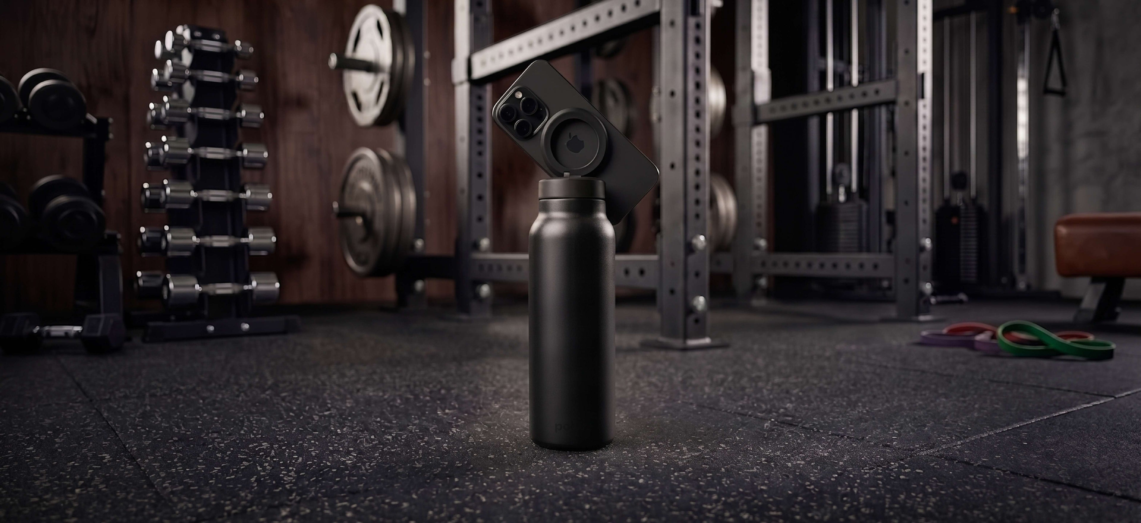 Carbon magnetic water bottle phone holder used as a workout tripod for filming and training in the gym