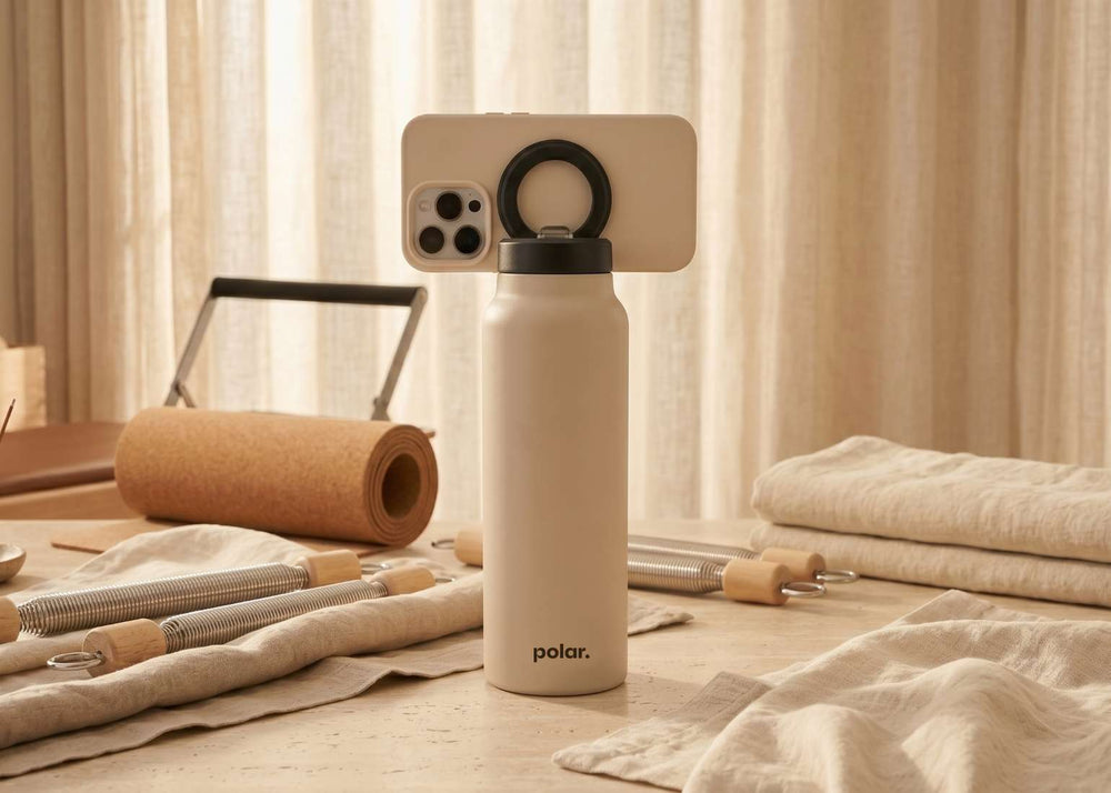 Sand magnetic water bottle phone stand used for hands-free viewing and everyday routines at home