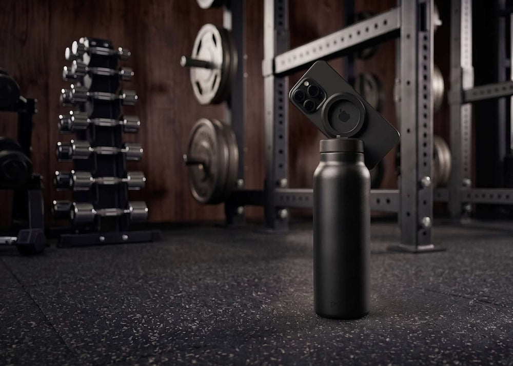 Carbon magnetic water bottle phone holder used as a workout tripod for filming and training in the gym