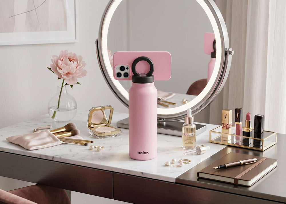 Bloom magnetic water bottle phone mount used as a tripod for hands-free filming at a vanity setup