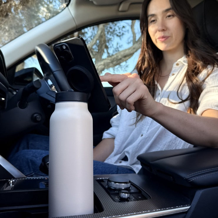 Sand magnetic water bottle phone stand used for hands-free navigation and use in the car