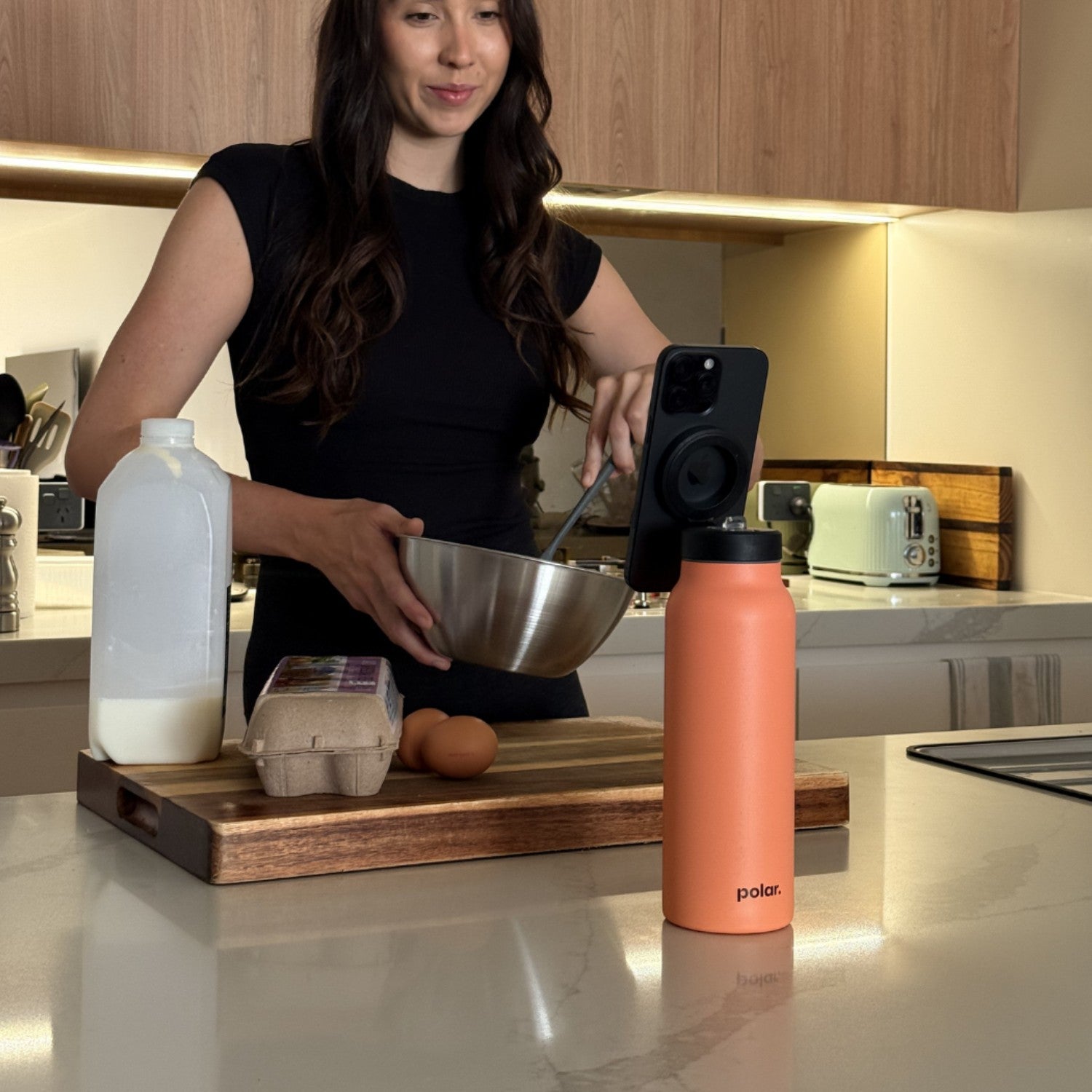 Sundust magnetic water bottle phone stand used as a tripod for hands-free cooking and following recipes